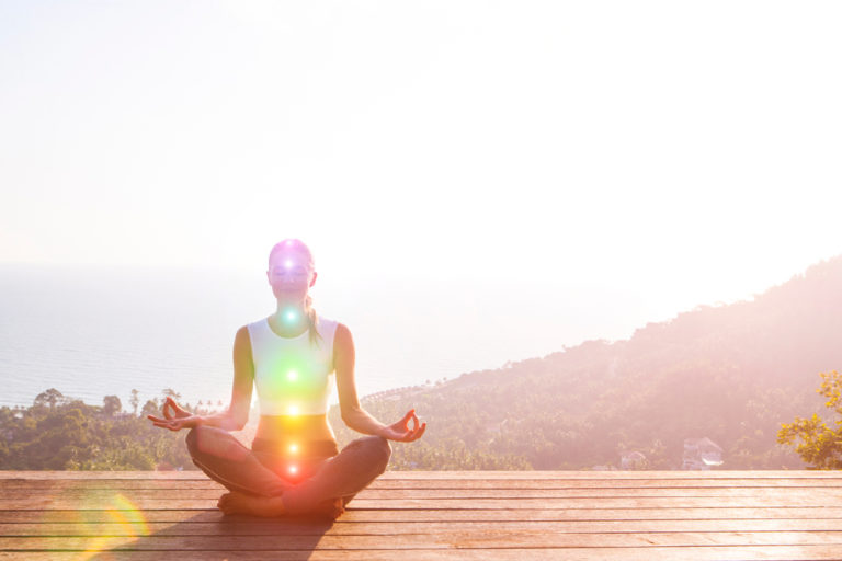 woman doing a yoga pose in the sunshine